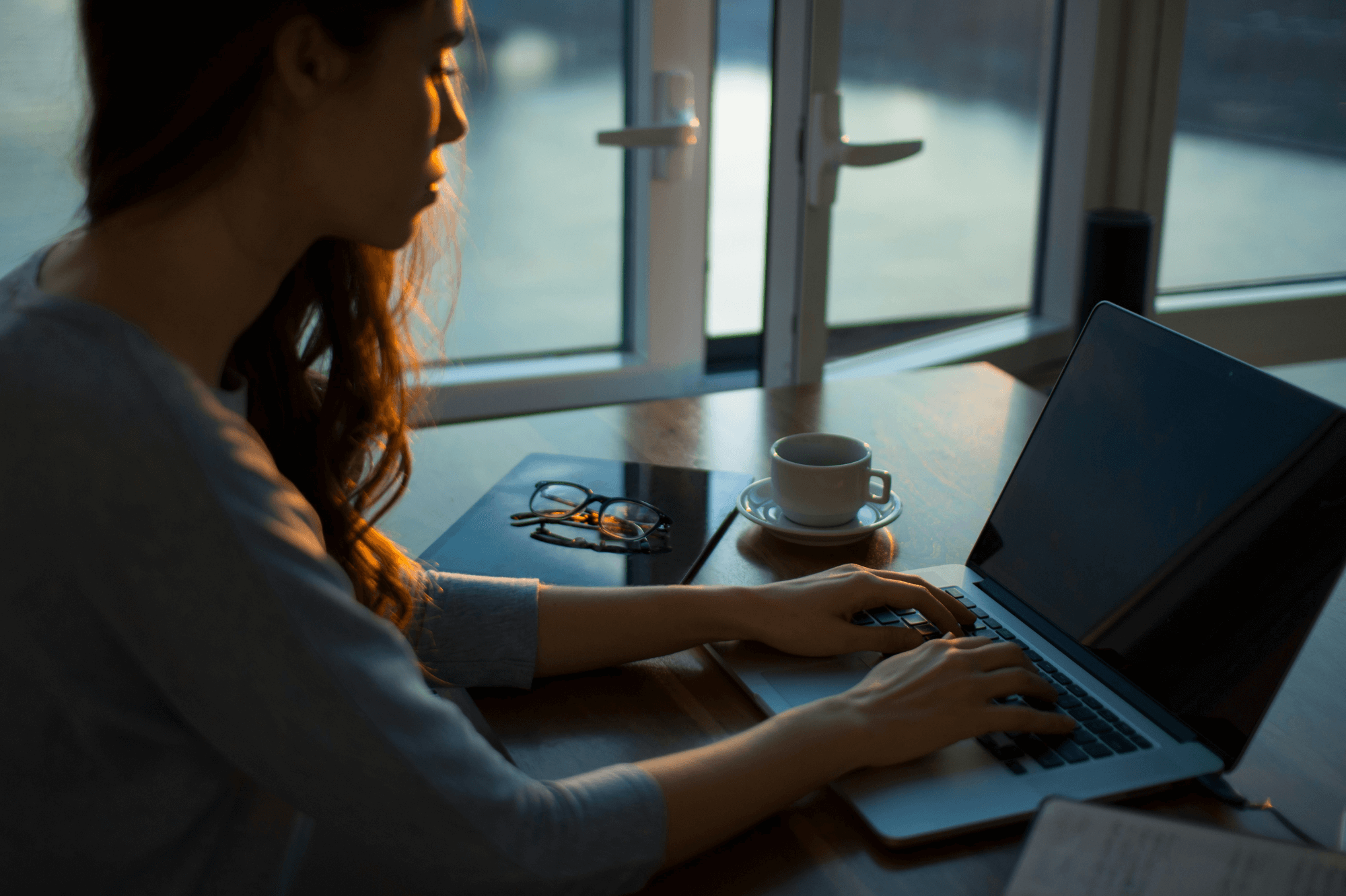 woman typing on laptop