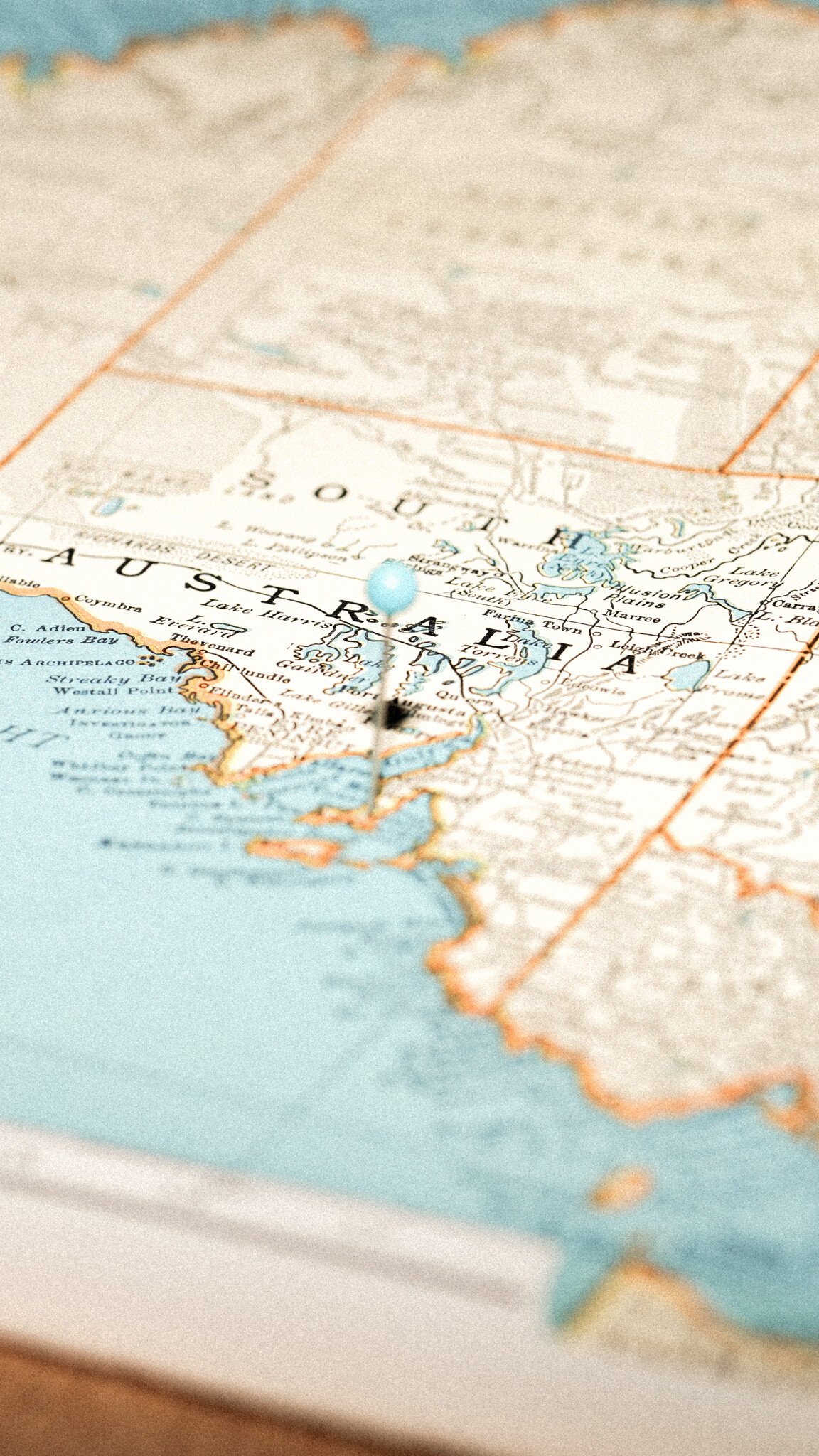 Close-up of a map focusing on South Australia, with a pin marking Port Adelaide. The map shows coastline and geographical details in muted blue and beige tones.