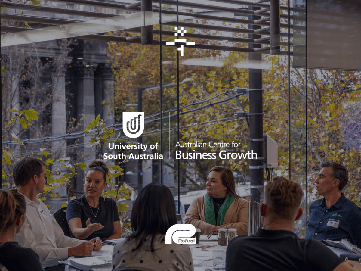 UniSA australian centre for business growth logo on an image of a team around a table