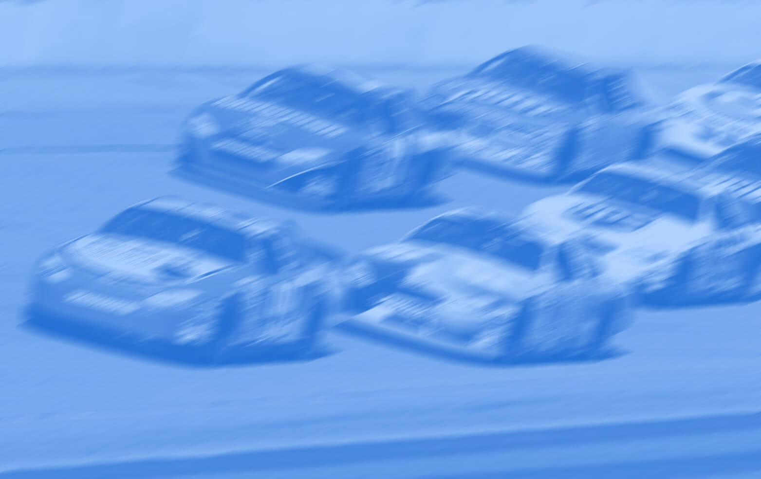 Six NASCAR cars racing on track